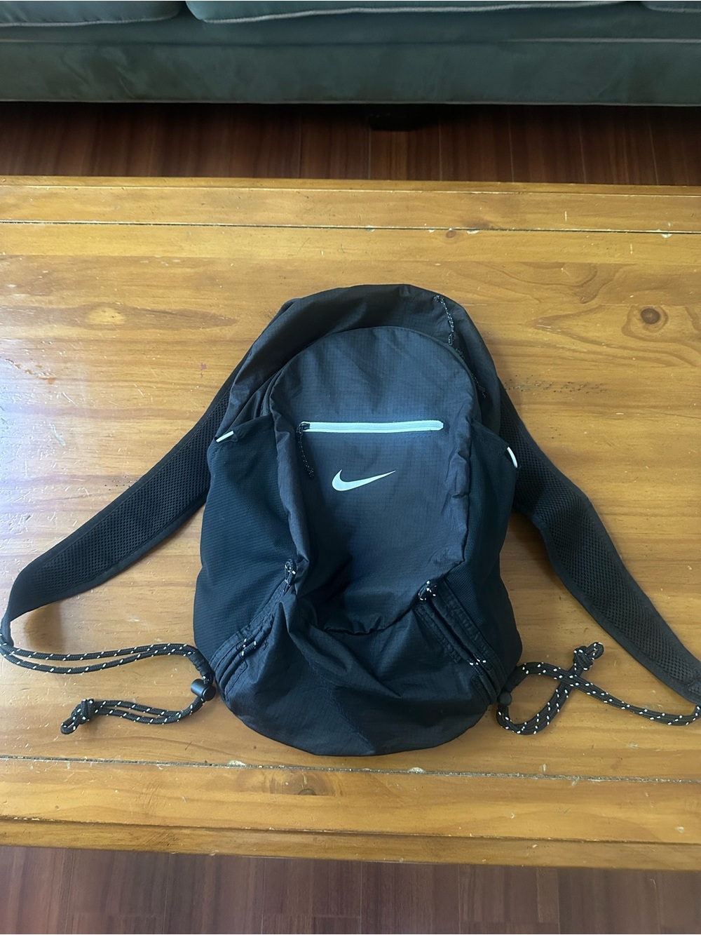 Nike Black Backpack with White Swoosh and Light Gray Zipper Accent